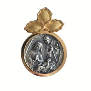 Medalla de la Sagrada Familia en el Belén